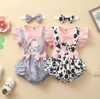 Komplet Odjeće od tri predmeta za novorođene djevojčice, majice s rukavima-svjetiljke i okruglog izreza + kratke hlače na подтяжках s po cijeloj površini mliječne krave + povez za glavu